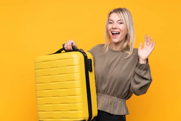 Young Blonde Woman Isolated Yellow Background Vacation Travel Suitcase Making — 스톡 사진