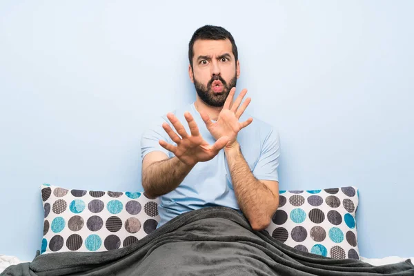 Man Bed Nervous Stretching Hands Front — 스톡 사진