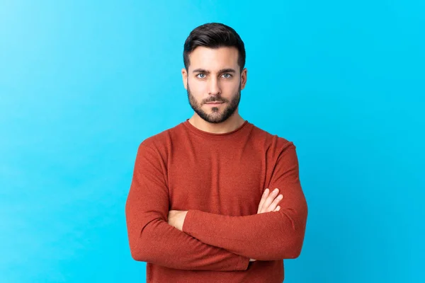 Joven Hombre Guapo Con Barba Sobre Fondo Azul Aislado Manteniendo — Foto de Stock