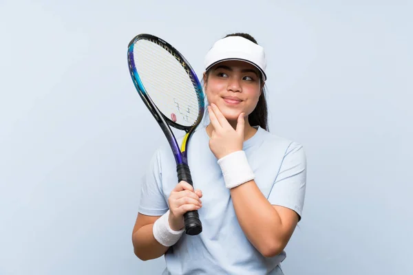 Young Teenager Asian Girl Playing Tennis Thinking Idea — ストック写真