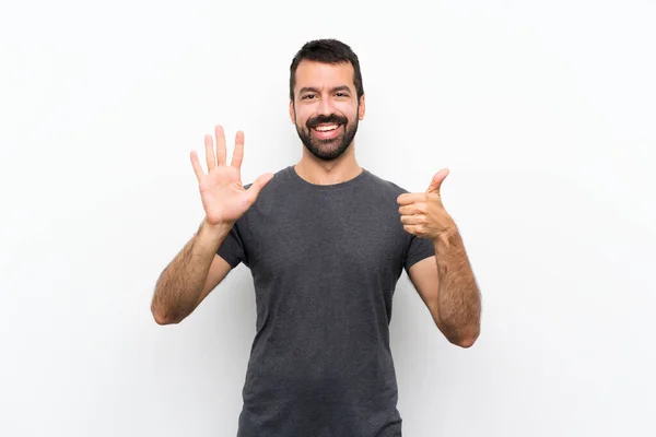 Mladý Pohledný Muž Přes Izolované Bílé Pozadí Počítání Šest Prsty — Stock fotografie