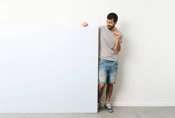 Young Handsome Man Beard Holding Big Blue Empty Placard Thinking — ストック写真