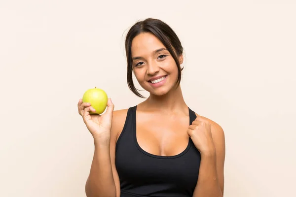 孤立した背景の上にリンゴを持つ若いブルネットの女の子 — ストック写真