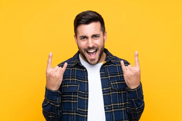 Young Handsome Man Beard Isolated Yellow Background Making Rock Gesture — 스톡 사진