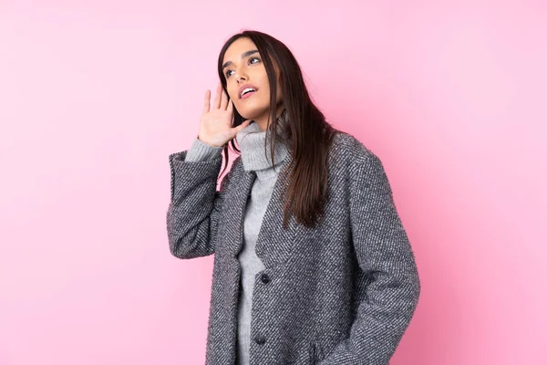 Young Brunette Woman Isolated Pink Background Listening Something Putting Hand — 스톡 사진