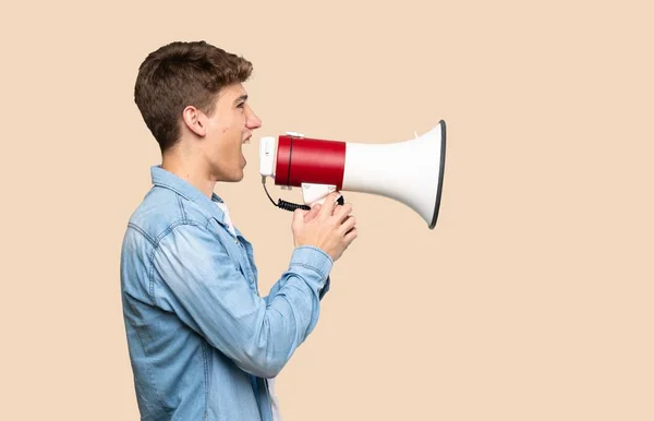 Handsome Young Man Shouting Megaphone Isolated Background — 스톡 사진