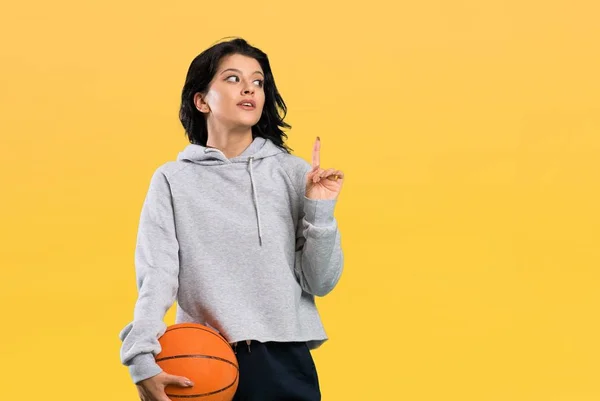 Young Woman Playing Basketball Intending Realizes Solution While Lifting Finger — 스톡 사진