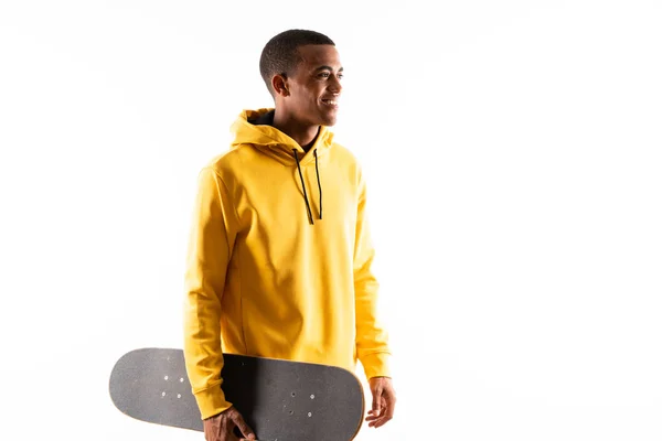 Afro American skater man over isolated white background — Stok Foto