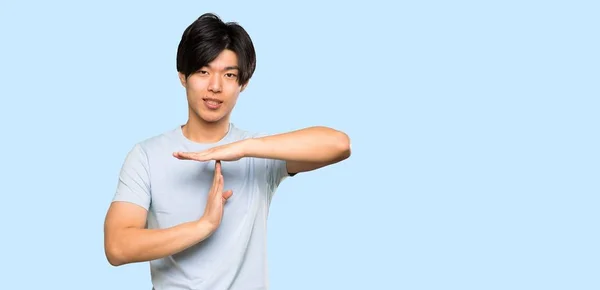 Asian Man Blue Shirt Making Time Out Gesture Isolated Blue — 스톡 사진