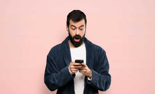 Man Beard Pajamas Surprised Sending Message Isolated Pink Background — Stok fotoğraf