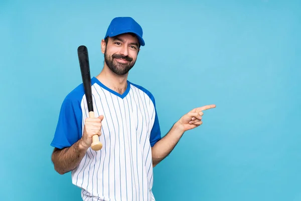 Young Man Playing Baseball Isolated Blue Background Pointing Finger Side — Stock Photo, Image