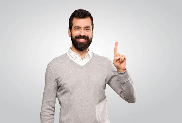 Handsome Man Showing Lifting Finger Sign Best Isolated Grey Background — Stockfoto