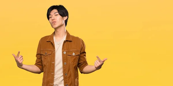 Asian Man Brown Jacket Proud Self Satisfied Isolated Yellow Background — 스톡 사진