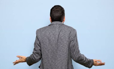 Handsome man with beard over isolated blue background