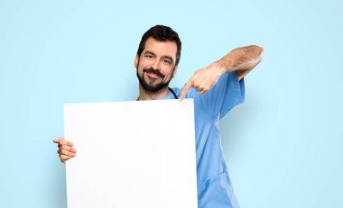 Cerrah doktor adam boş bir afişini holding