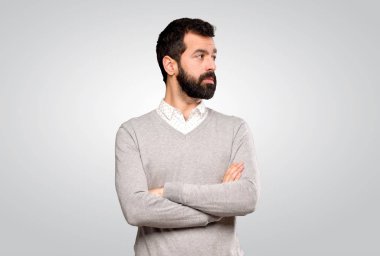 Handsome man portrait over isolated grey background