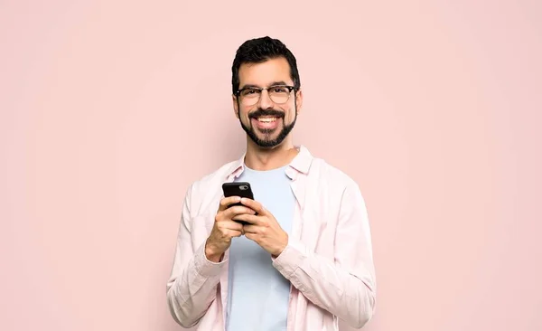 Handsome Man Beard Sending Message Mobile Isolated Pink Background — Stock Photo, Image