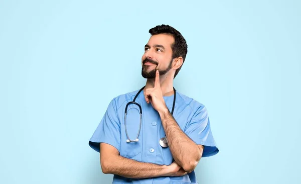 Surgeon Doctor Man Thinking Idea While Looking Isolated Blue Background — Stockfoto