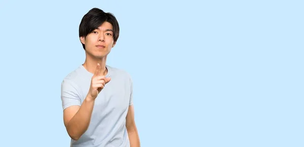 Asian Man Blue Shirt Frustrated Pointing Front Isolated Blue Background — 스톡 사진