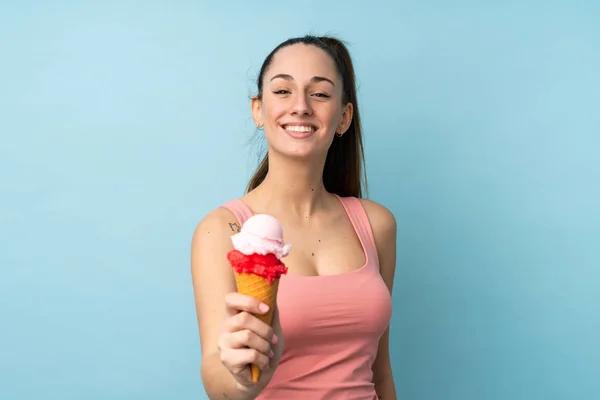 Young Brunette Woman Cornet Ice Cream Isolated Blue Background Happy — Stock Photo, Image