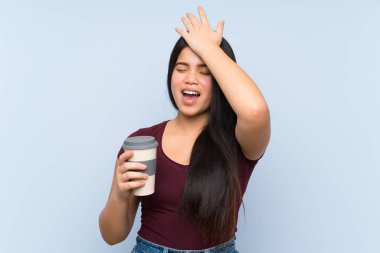 Young teenager Asian girl holding a take away coffee has realized something and intending the solution