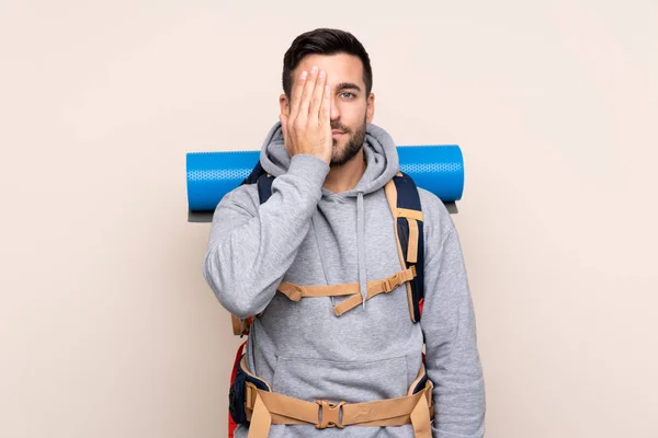 Young Mountaineer Man Big Backpack Isolated Background Covering Eye Hand — 스톡 사진