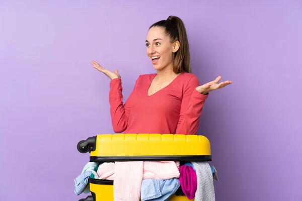Traveler Woman Suitcase Full Clothes Isolated Purple Background Surprise Facial — Stock Photo, Image