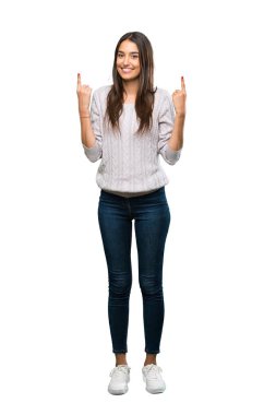 A full-length shot of a Young hispanic brunette woman pointing up a great idea over isolated white background