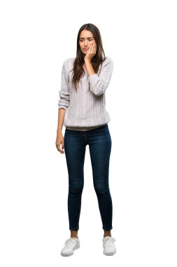 A full-length shot of a Young hispanic brunette woman with toothache over isolated white background