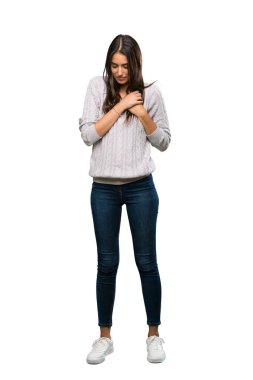 A full-length shot of a Young hispanic brunette woman having a pain in the heart over isolated white background