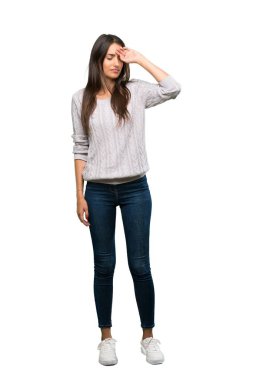 A full-length shot of a Young hispanic brunette woman with tired and sick expression over isolated white background