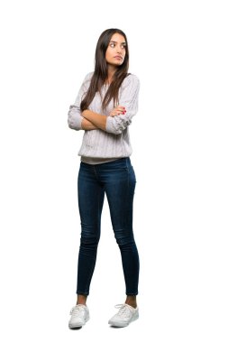 A full-length shot of a Young hispanic brunette woman portrait over isolated white background