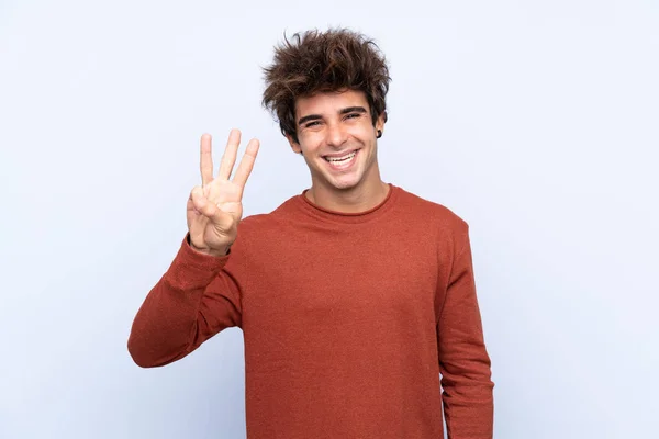 Joven Caucásico Hombre Sobre Aislado Azul Fondo Feliz Contando Tres —  Fotos de Stock