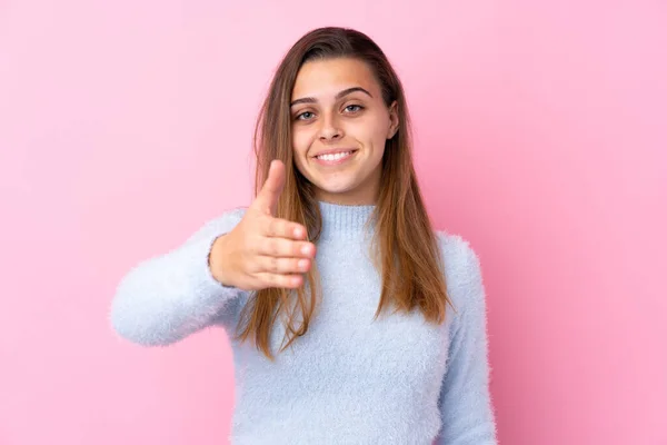 Teenager Girl Blue Sweater Isolated Pink Background Handshaking Good Deal — Stok fotoğraf