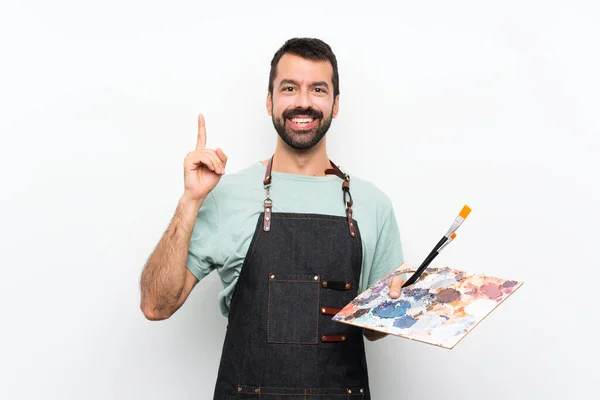 Jovem Artista Homem Segurando Uma Paleta Sobre Fundo Isolado Apontando — Fotografia de Stock