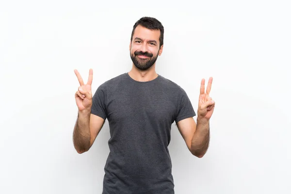 Jovem Homem Bonito Sobre Isolado Fundo Branco Mostrando Sinal Vitória — Fotografia de Stock