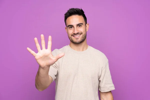 Young Handsome Man Isolated Purple Background Counting Five Fingers — Stok fotoğraf