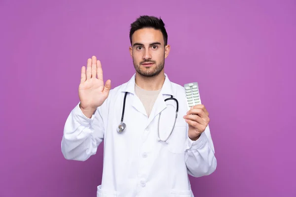 Young Man Wearing Doctor Gown Holding Pills While Doing Stop — 图库照片