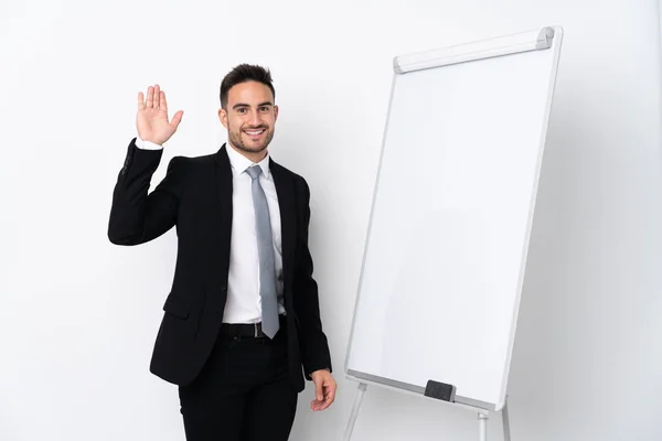 Jongeman Geeft Een Presentatie Wit Bord Salueert Met Hand — Stockfoto