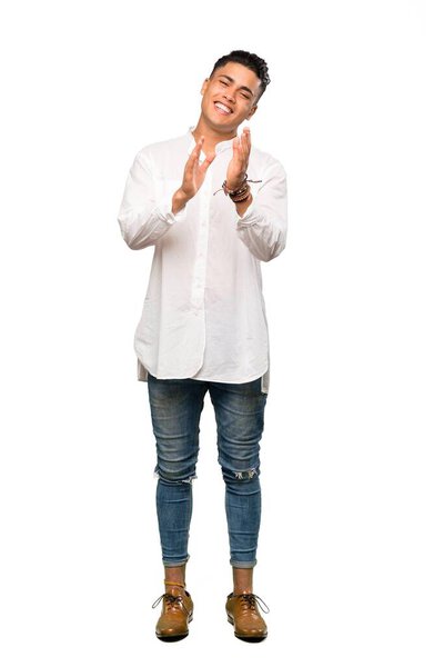 A full-length shot of a Young man applauding after presentation in a conference over isolated white background