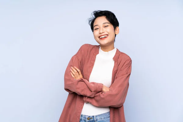 Young Asian Girl Isolated Blue Background Keeping Arms Crossed Frontal — Stock Photo, Image