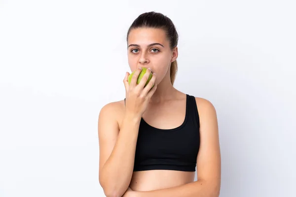 Adolescente chica con una manzana sobre fondo aislado — Foto de Stock