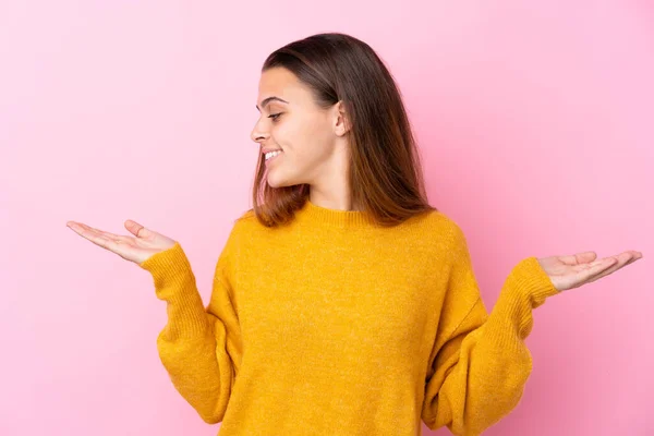 Teenager Girl Yellow Sweater Isolated Pink Background Holding Copyspace Two — 스톡 사진