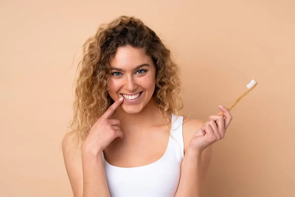 Young Blonde Woman Curly Hair Isolated Beige Background Toothbrush Happy — Stock Photo, Image