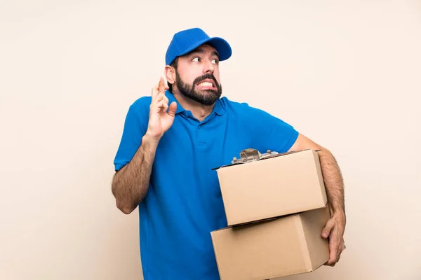 Delivery Man Beard Isolated Background Fingers Crossing Wishing Best — Stock Photo, Image