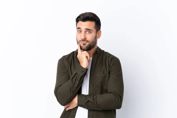 Joven Hombre Guapo Con Barba Sobre Fondo Blanco Aislado Mirando —  Fotos de Stock