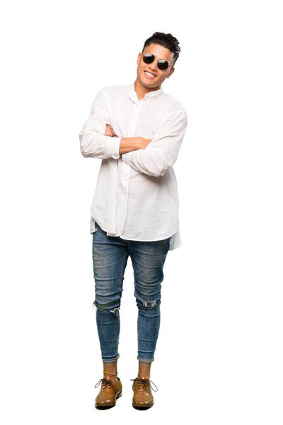 A full-length shot of a Young man with glasses and smiling over isolated white background