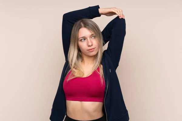 Ung Sport Blond Kvinna Över Isolerad Bakgrund Stretching — Stockfoto