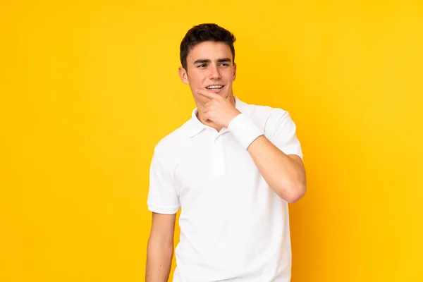 Handsome Teenager Tennis Player Man Isolated Yellow Background Playing Tennis — Stock Photo, Image