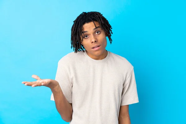 Young African American Man Isolated Blue Background Making Doubts Gesture — 스톡 사진